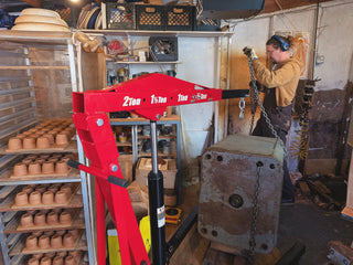 Sven using a machine to lift the Ram Press body out of it's home in our old studio (in chaos)